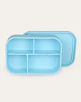 Light blue bento box with compartments on a light gray background