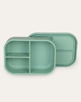 Green divided lunch box on a white background
