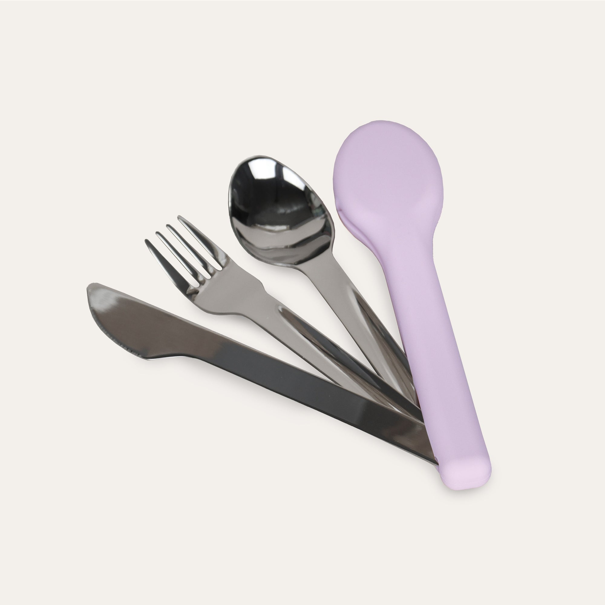 Set of silver cutlery with a purple holder on a light gray background